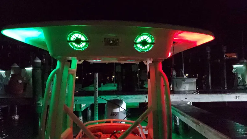 Slide: The Image of Everglades 243 CC 2006 boat with green and red lights at night dock. - 20