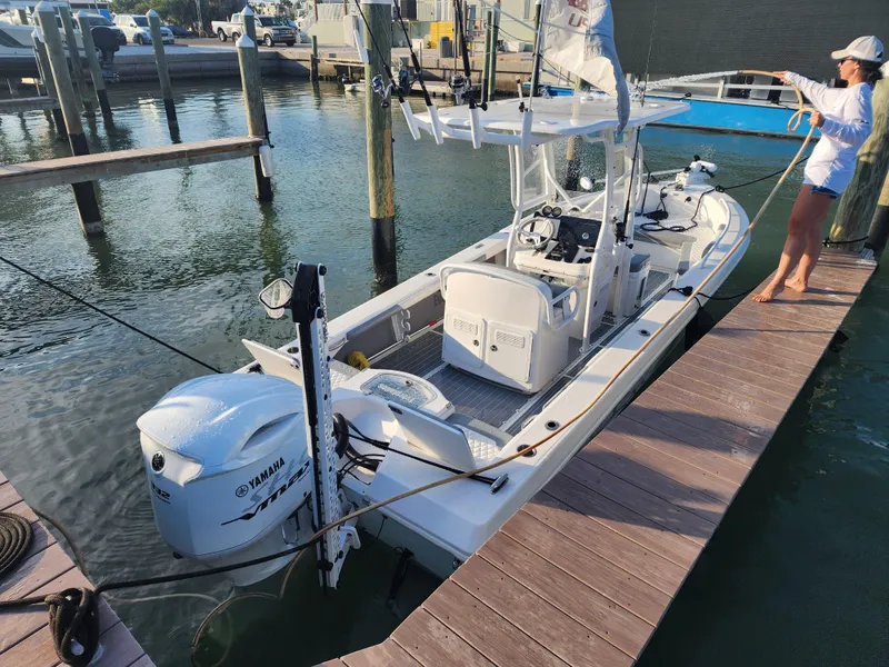 Slide: The Image of 2006 Everglades 243 CC boat docked, equipped with Yamaha outboard motor. - 22