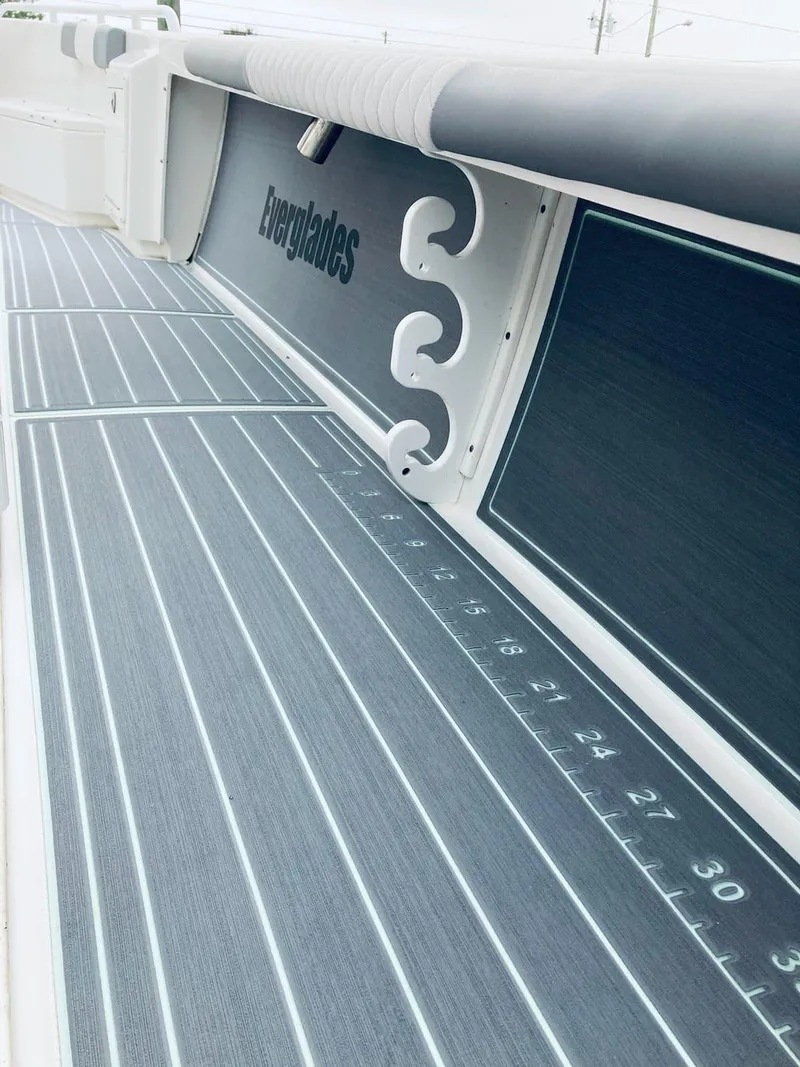 Slide: The Image of 2006 Everglades 243 CC boat deck with ruler markings and Everglades branding. - 27