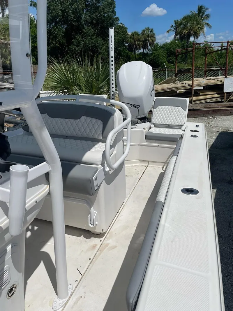 Slide: The Image of 2006 Everglades 243 CC center console boat with seating and outboard motor. - 39