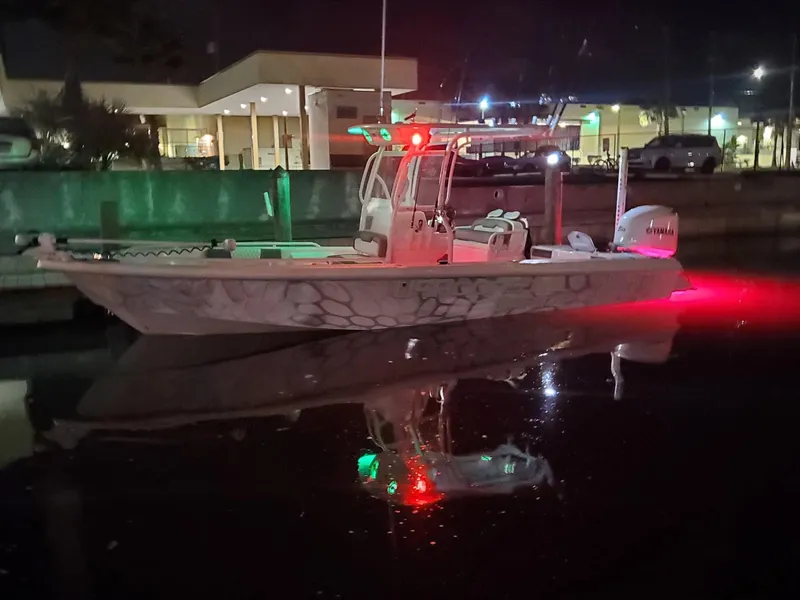 Slide: The Image of 2006 Everglades 243 CC boat with night lights docked in a marina. - 4
