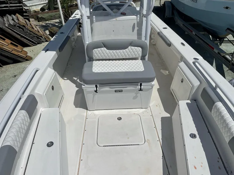 Slide: The Image of 2006 Everglades 243 CC boat interior with seating and storage compartments. - 40