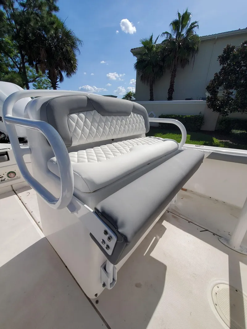 Slide: The Image of 2006 Everglades 243 CC boat with cushioned seating and white upholstery. - 41