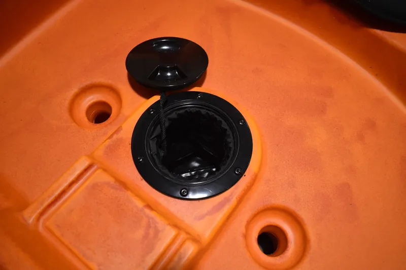 Slide: The Image of Orange Ascend 12R Sport Sit-On kayak hatch, 2021 model, with open storage compartment. - 10