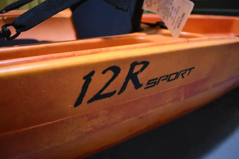 Slide: The Image of Orange Ascend 12R Sport Sit-On kayak, 2021 model, close-up view. - 13