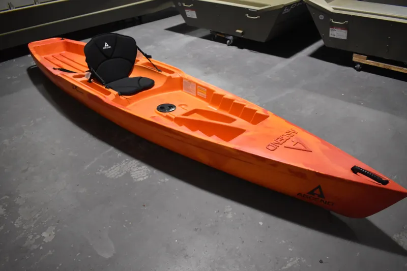 The Image of Orange 2021 Ascend 12R Sport Sit-On kayak in a storage area. - 4