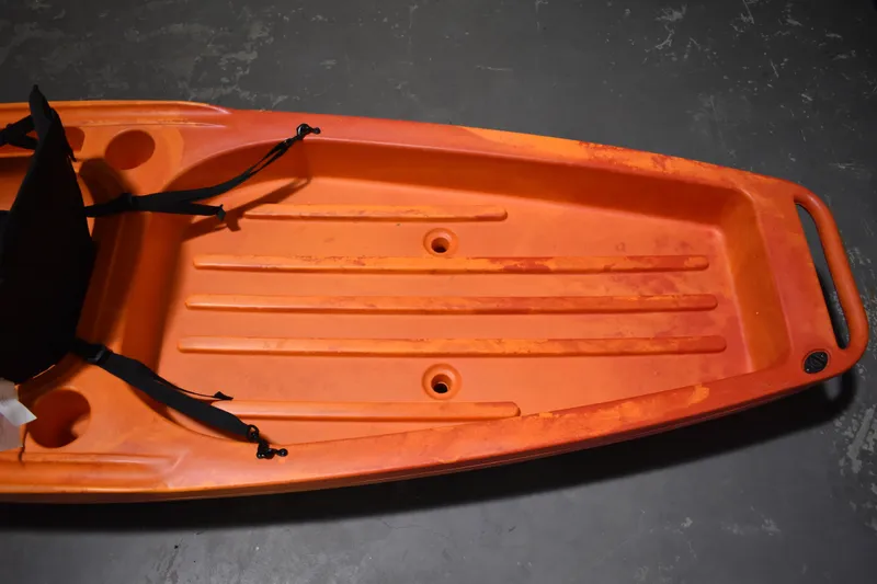 Slide: The Image of Orange Ascend 12R Sport Sit-On kayak, 2021 model, featuring a textured seat area. - 7