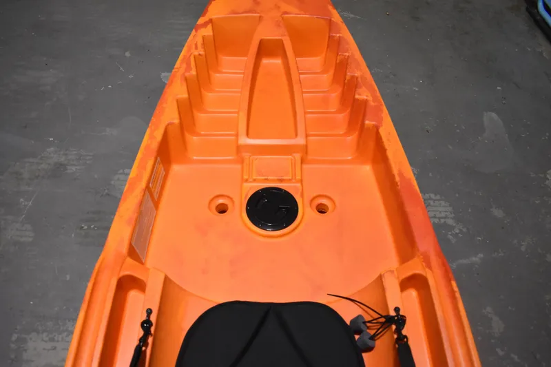 Slide: The Image of Orange Ascend 12R Sport Sit-On kayak, 2021 model, showing seating and storage area. - 8