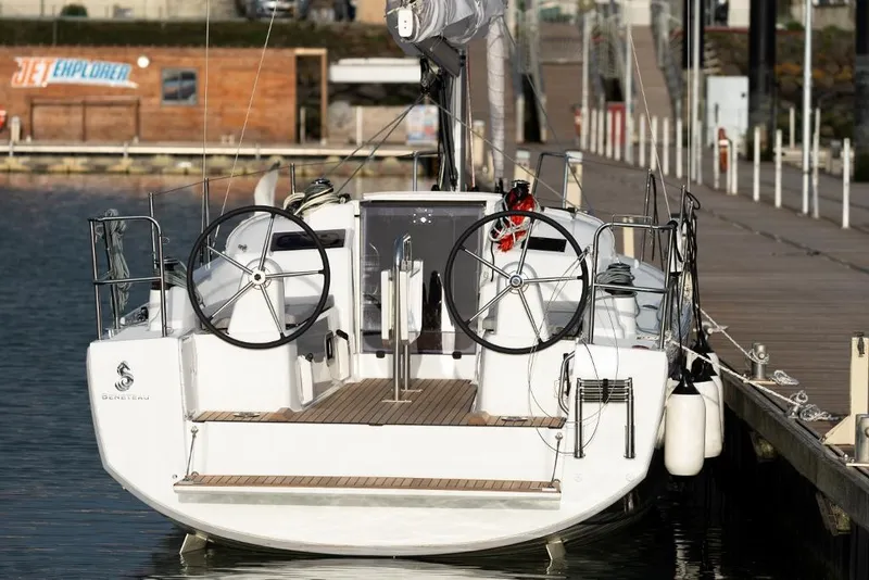 Slide: The Image of 2024 Beneteau Oceanis 30.1 sailboat docked at marina, rear view. - 23