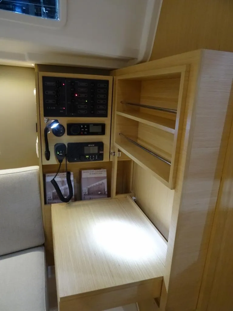 Slide: The Image of 2024 Beneteau Oceanis 30.1 yacht interior with navigation station and control panel. - 15