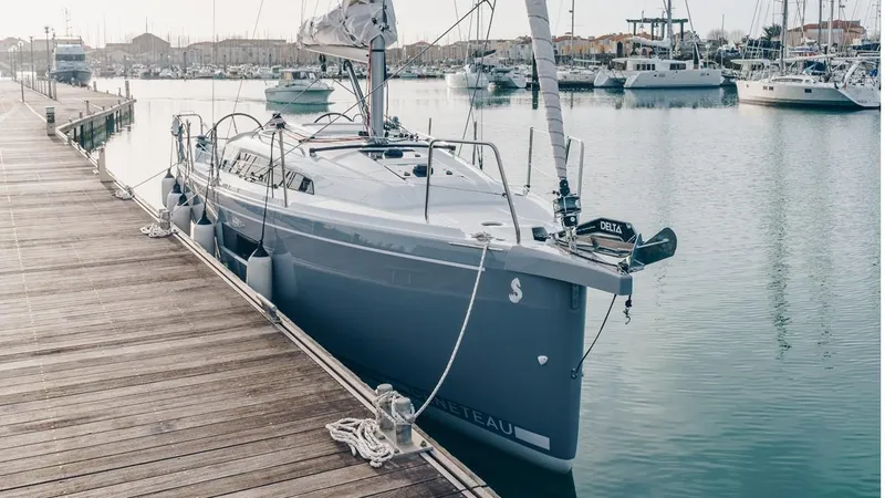 Slide: The Image of 2024 Beneteau Oceanis 30.1 sailboat docked at marina. - 21