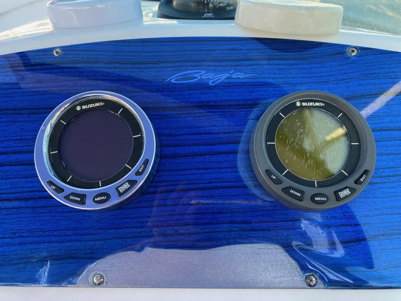 Slide: The Image of Baja 23 Islander 2016 dashboard with Suzuki gauges on blue panel. - 11