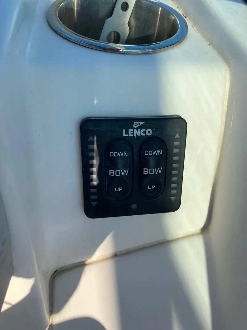 Slide: The Image of Lenco trim tab control panel on a 2016 Baja 23 Islander boat. - 13