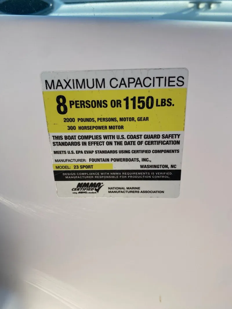 Slide: The Image of 2016 Baja 23 Islander boat capacity label: 8 persons or 1150 lbs, 300 HP motor. - 15