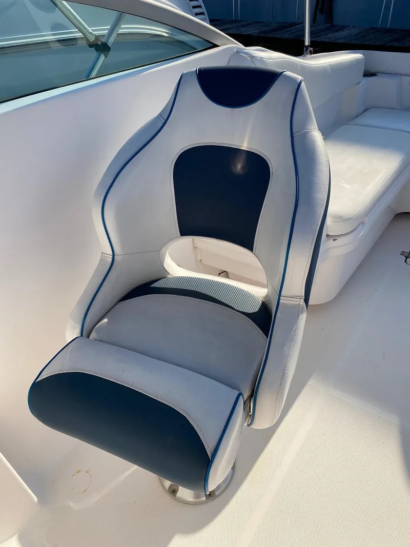 Slide: The Image of Captain's chair on a 2016 Baja 23 Islander boat. - 16