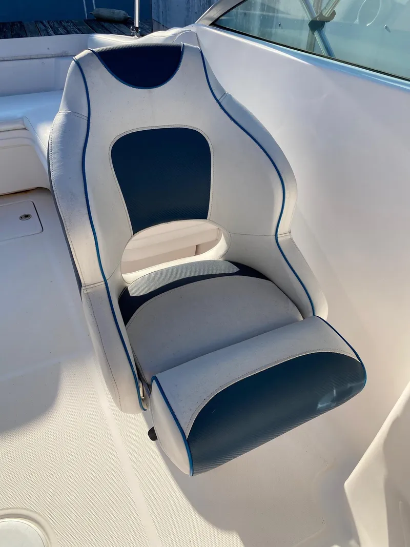 Slide: The Image of 2016 Baja 23 Islander boat seat with blue and white upholstery. - 17