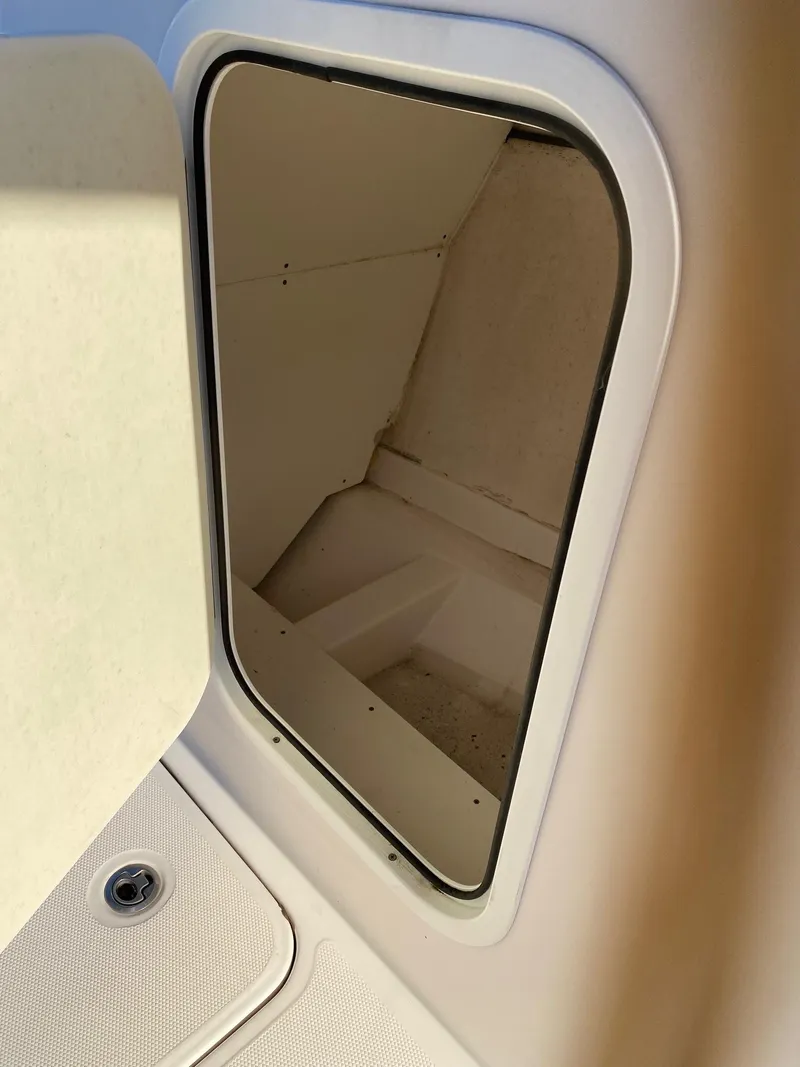 Slide: The Image of Storage compartment of a 2016 Baja 23 Islander boat. - 19