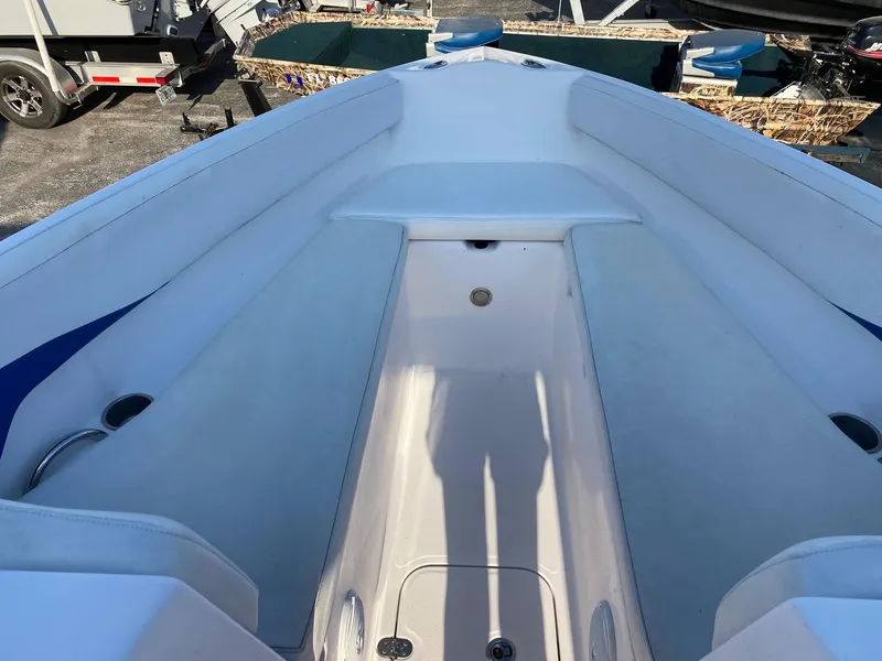 Slide: The Image of 2016 Baja 23 Islander boat interior with seating and storage compartments. - 21