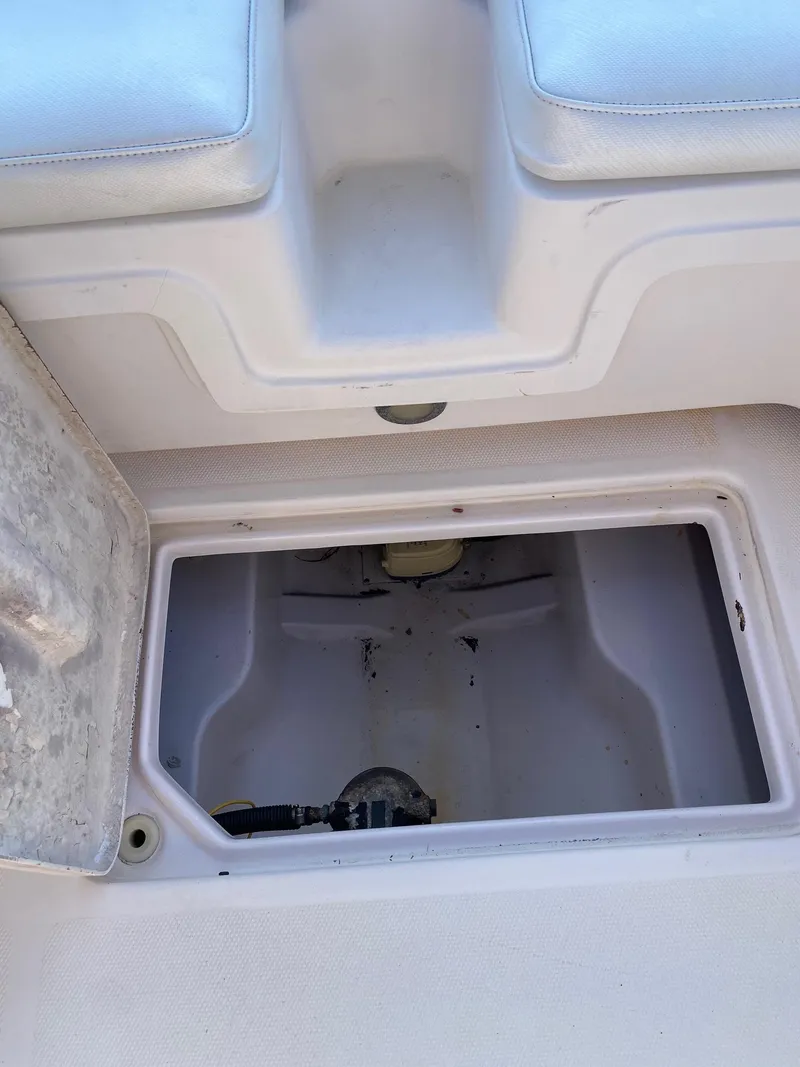 Slide: The Image of Storage compartment of a 2016 Baja 23 Islander boat. - 24