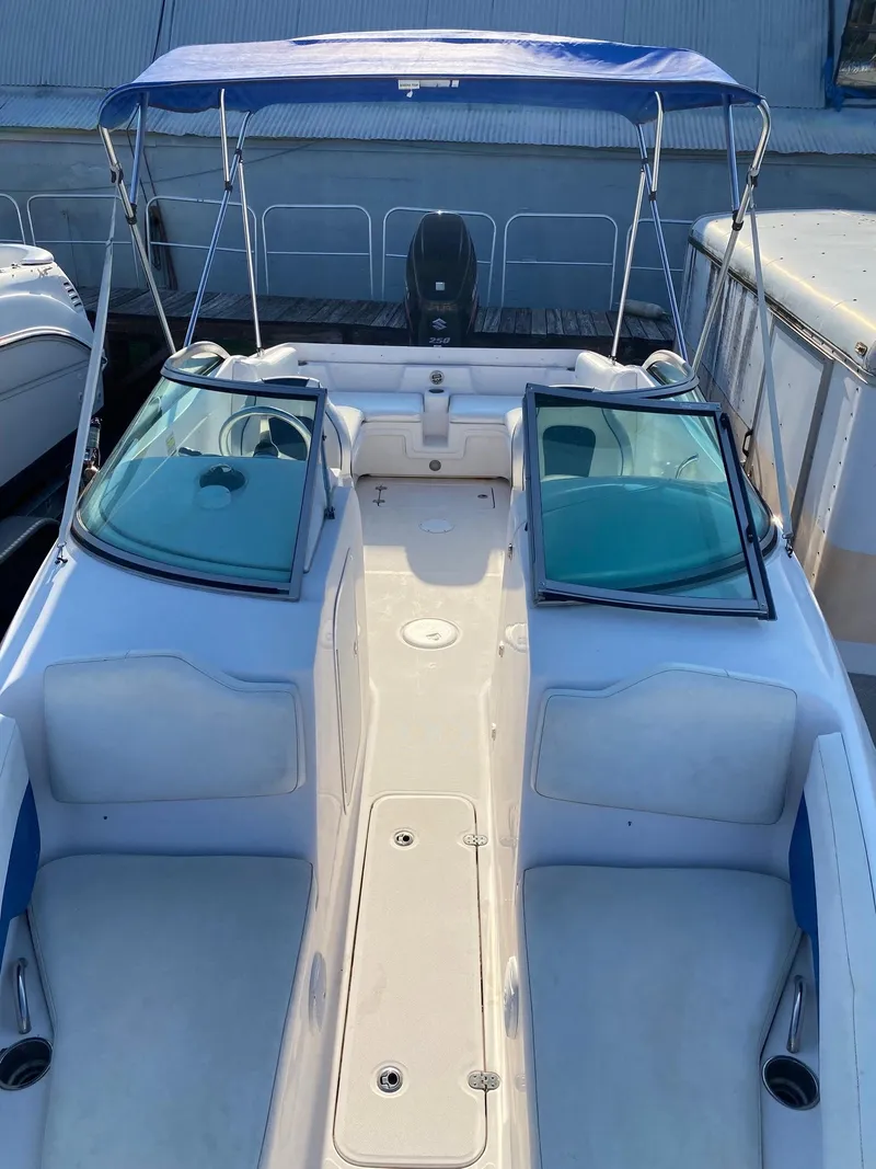 Slide: The Image of 2016 Baja 23 Islander boat with blue canopy and spacious seating. - 6