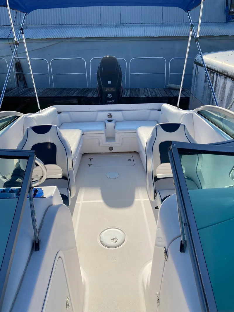 Slide: The Image of 2016 Baja 23 Islander boat interior with seating and outboard motor. - 8