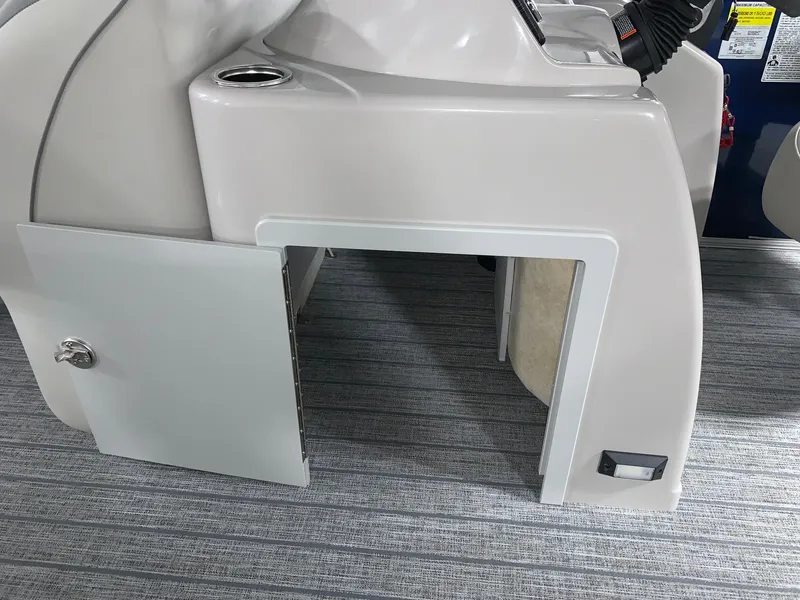 Slide: The Image of 2024 Starcraft EX22 FD boat storage compartment with open door. - 11