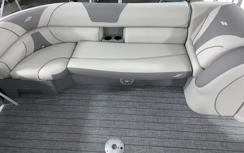 Slide: The Image of 2024 Starcraft EX22 FD boat interior with gray and white cushioned seating. - 6