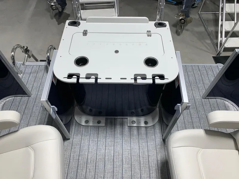 Slide: The Image of 2024 Starcraft EX22 FD boat interior with seating and storage compartments. - 18