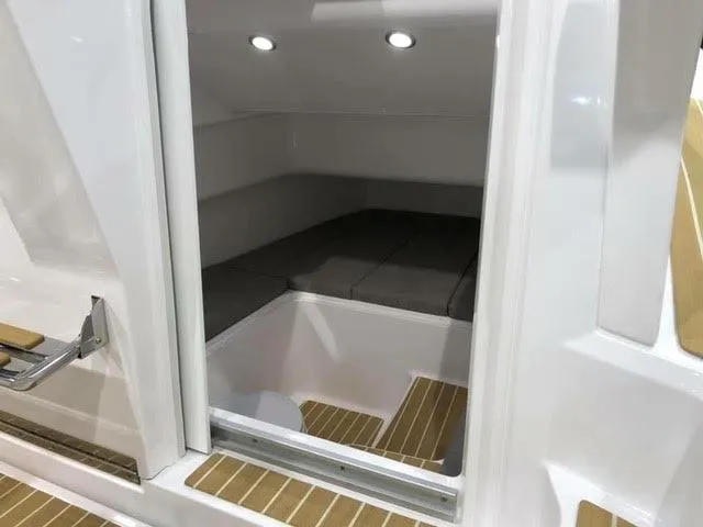 Slide: The Image of 2020 Zar Formenti 85 SL cabin interior with cushioned seating and LED lighting. - 12