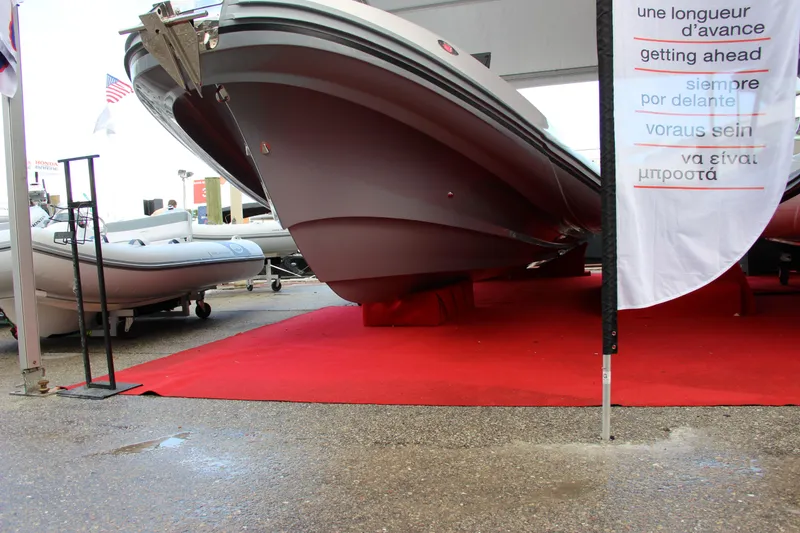 Slide: The Image of Zar Formenti 85 SL 2020 model boat displayed on red carpet at a boat show. - 16