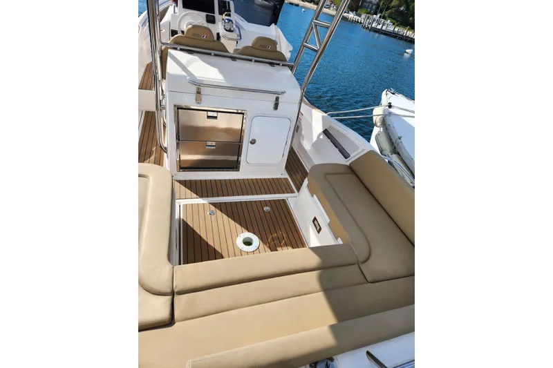 Slide: The Image of Luxurious 2020 Zar Formenti 85 SL boat interior with beige seating and wooden deck. - 19