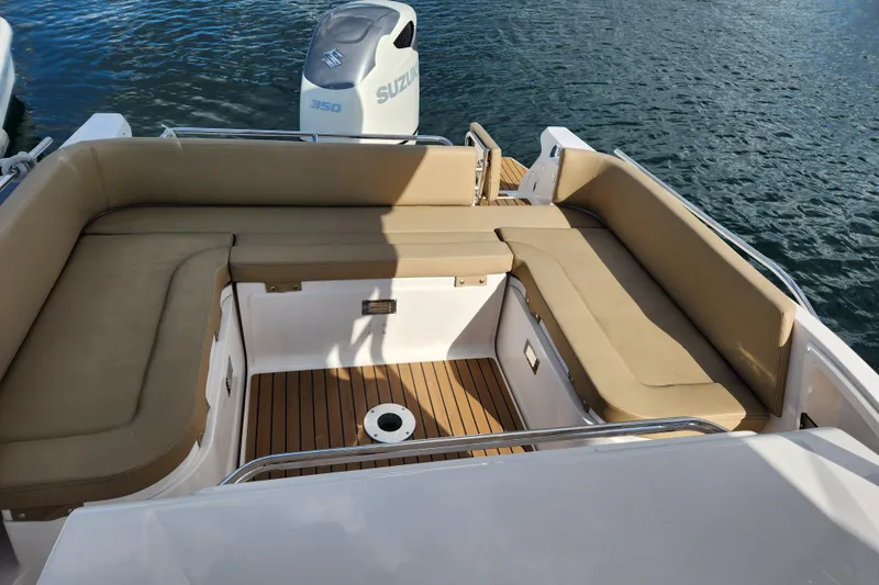 Slide: The Image of 2020 Zar Formenti 85 SL boat with tan seating and Suzuki 350 engine. - 20