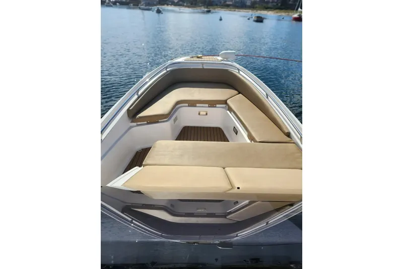 Slide: The Image of 2020 Zar Formenti 85 SL boat with beige seating, docked on calm water. - 23