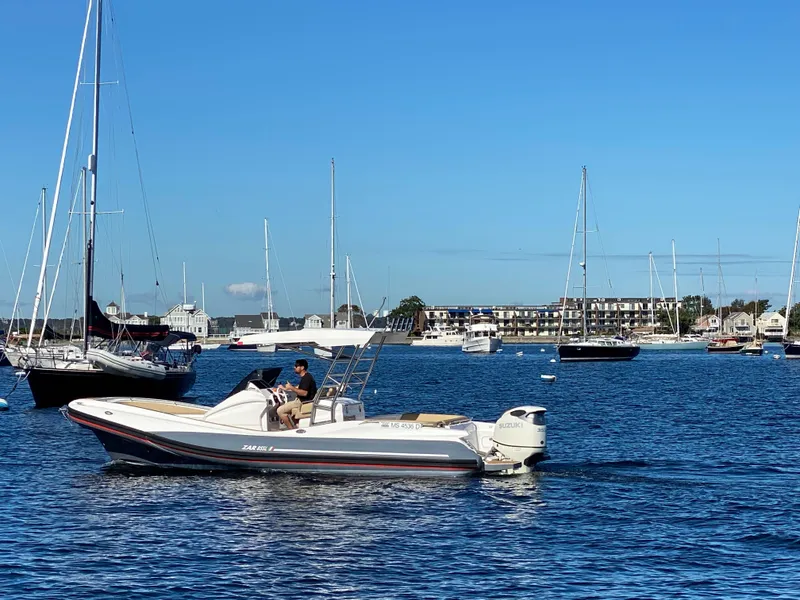 Slide: The Image of 2020 Zar Formenti 85 SL boat cruising in a scenic harbor with sailboats. - 3