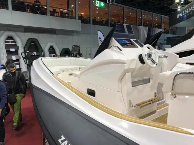 Slide: The Image of 2020 Zar Formenti 85 SL boat on display at an indoor boat show. - 5