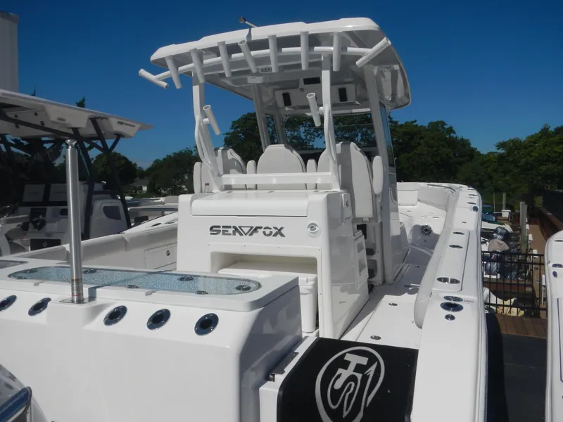 The Image of 2024 Sea Fox 328 Commander boat, rear view, white exterior, docked. - 0