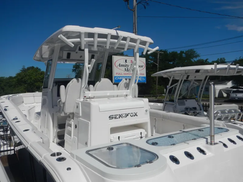 Slide: The Image of 2024 Sea Fox 328 Commander boat with white exterior and spacious deck. - 1