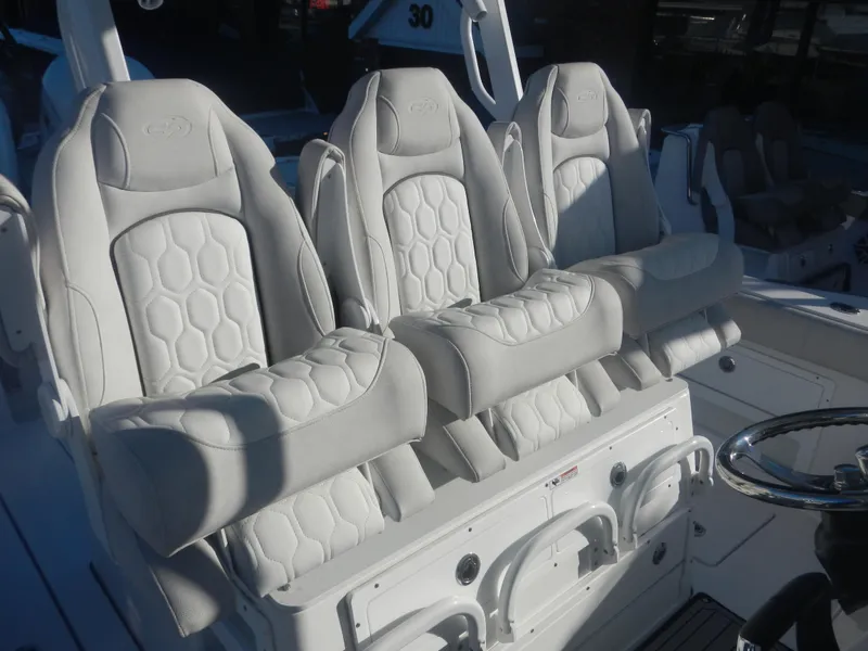 Slide: The Image of 2024 Sea Fox 328 Commander boat seats with luxurious white upholstery. - 11