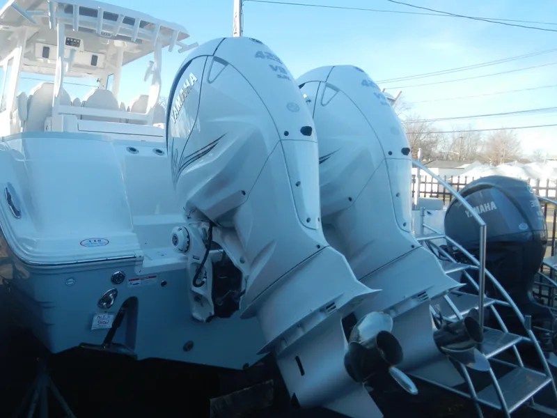 Slide: The Image of 2024 Sea Fox 328 Commander with twin Yamaha outboard engines. - 2