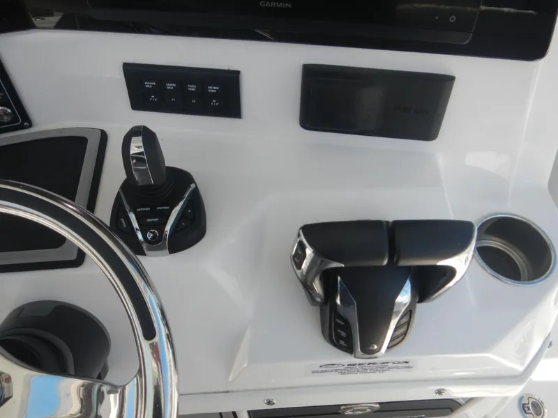 Slide: The Image of Control panel of 2024 Sea Fox 328 Commander boat with steering wheel and throttle. - 21
