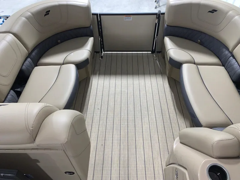 Slide: The Image of 2024 Starcraft SLS 3 Q DH pontoon boat interior with beige seating and flooring. - 11