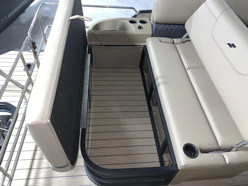 Slide: The Image of 2024 Starcraft SLS 3 Q DH boat interior with beige seating and storage area. - 5