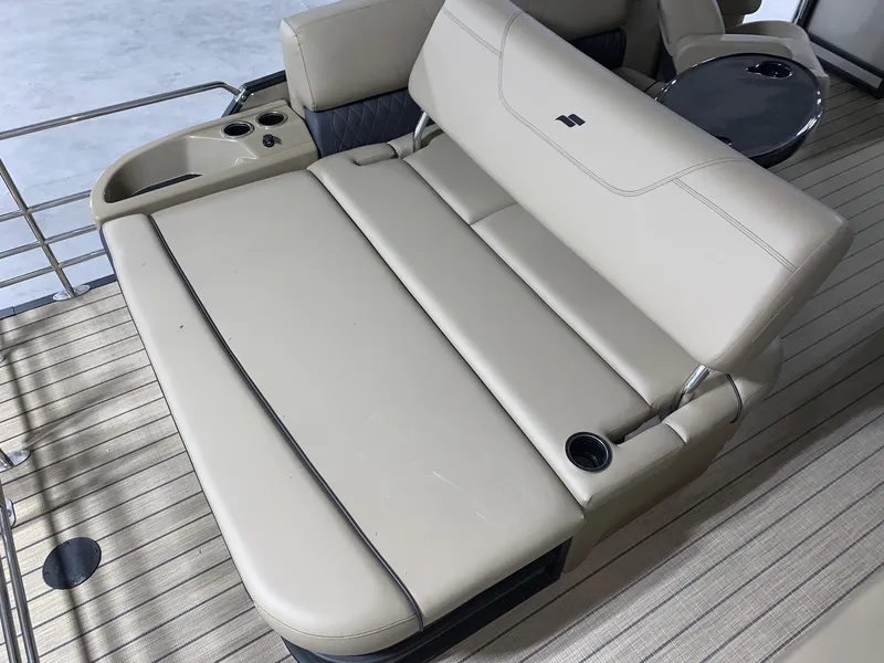 Slide: The Image of 2024 Starcraft SLS 3 Q DH boat with beige leather seating and cup holders. - 6