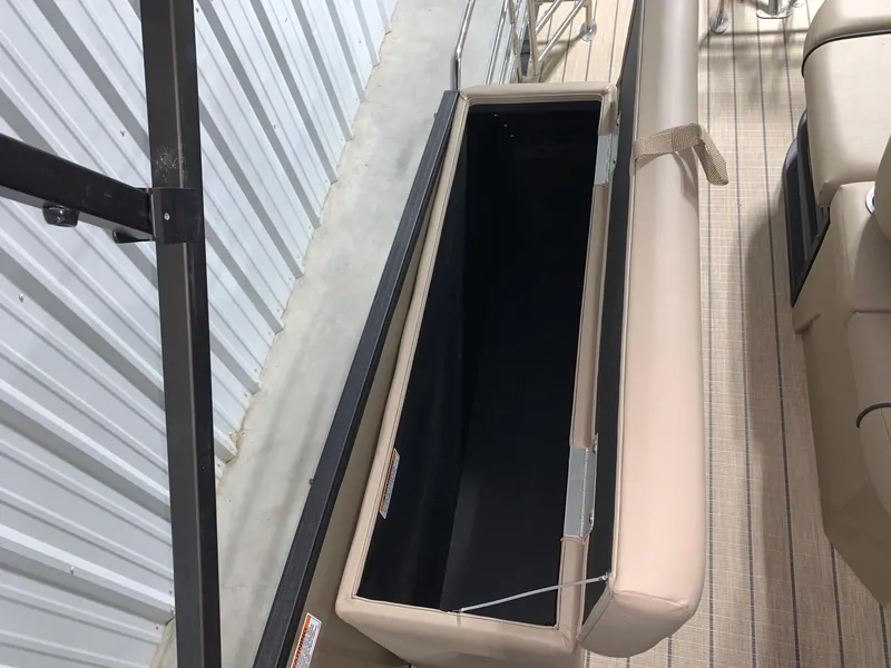 Slide: The Image of 2024 Starcraft SLS 3 Q DH boat storage compartment with beige seating. - 7