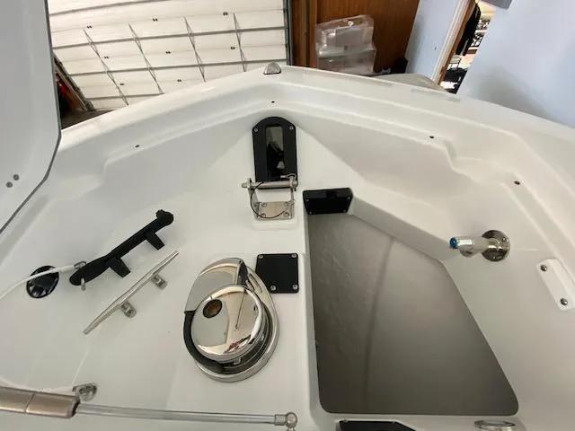 Slide: The Image of 2023 Blackfin 332 CC boat anchor locker and storage compartment. - 14