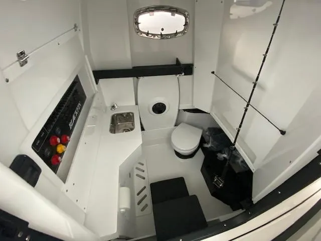 Slide: The Image of 2023 Blackfin 332 CC cabin interior with sink and toilet - 16