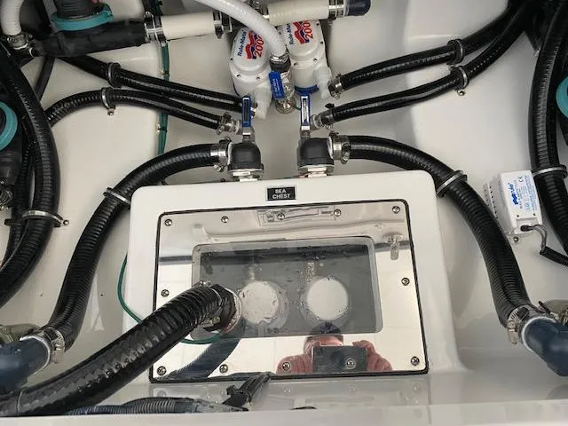 Slide: The Image of 2023 Blackfin 332 CC engine compartment with hoses and filters. - 3