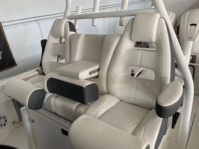 Slide: The Image of 2023 Blackfin 332 CC boat interior seating with white leather upholstery. - 4