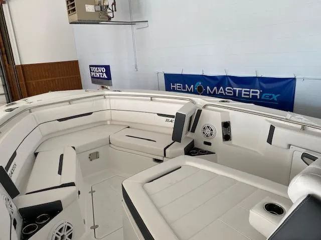 Slide: The Image of 2023 Blackfin 332 CC boat interior with white seating and Helm Master EX system. - 6