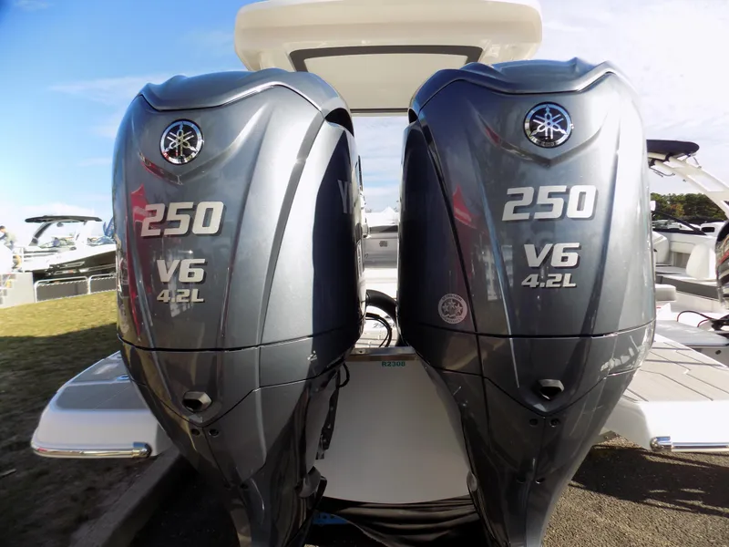 Slide: The Image of Twin Yamaha 250 V6 4.2L outboard engines on a 2023 Regal 29 OBX boat. - 16